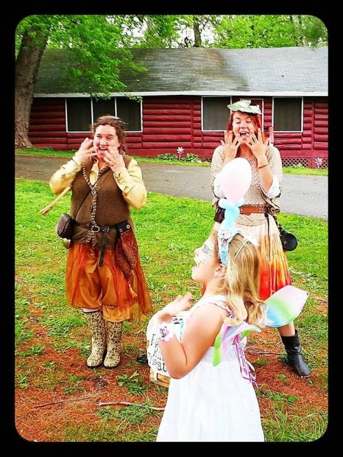 Fairy Ring Theater telling stories in front of Maryland Faerie Festival Cabins
